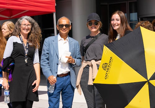 President Vivek Goel stands with March of the 1,000 Umbrella participants.