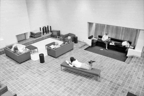 The atrium lounge area in the Minota Hagey residence circa 1968 with students lounging in a groovy setting.