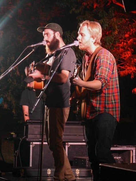 Guitarists perform at an Orientation event.