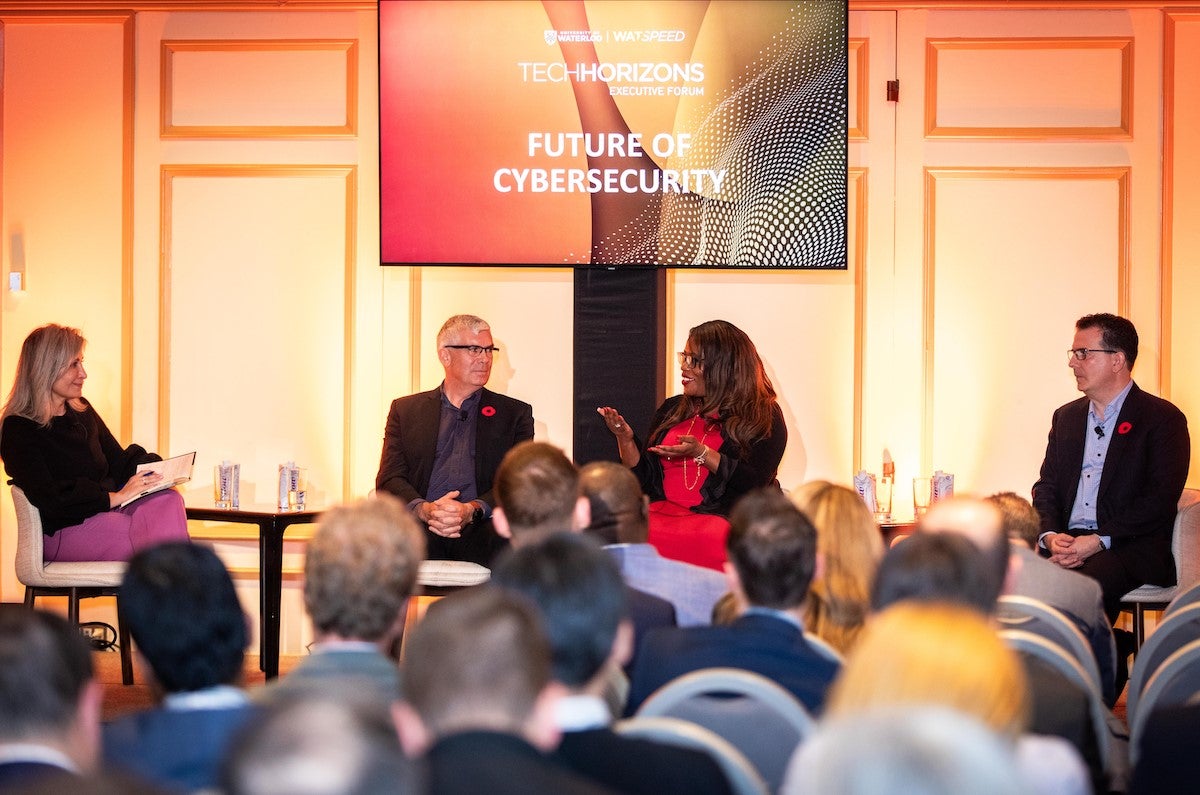 Panelists speak on stage at a previous Tech Horizons event.