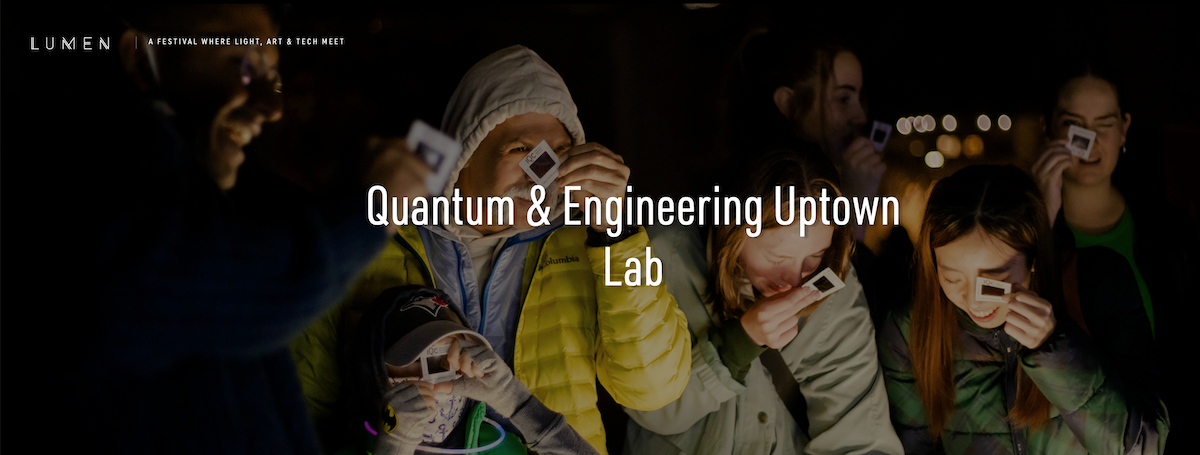 Lumen attendees peer through cardboard photo negatives at a University of Waterloo art installation.