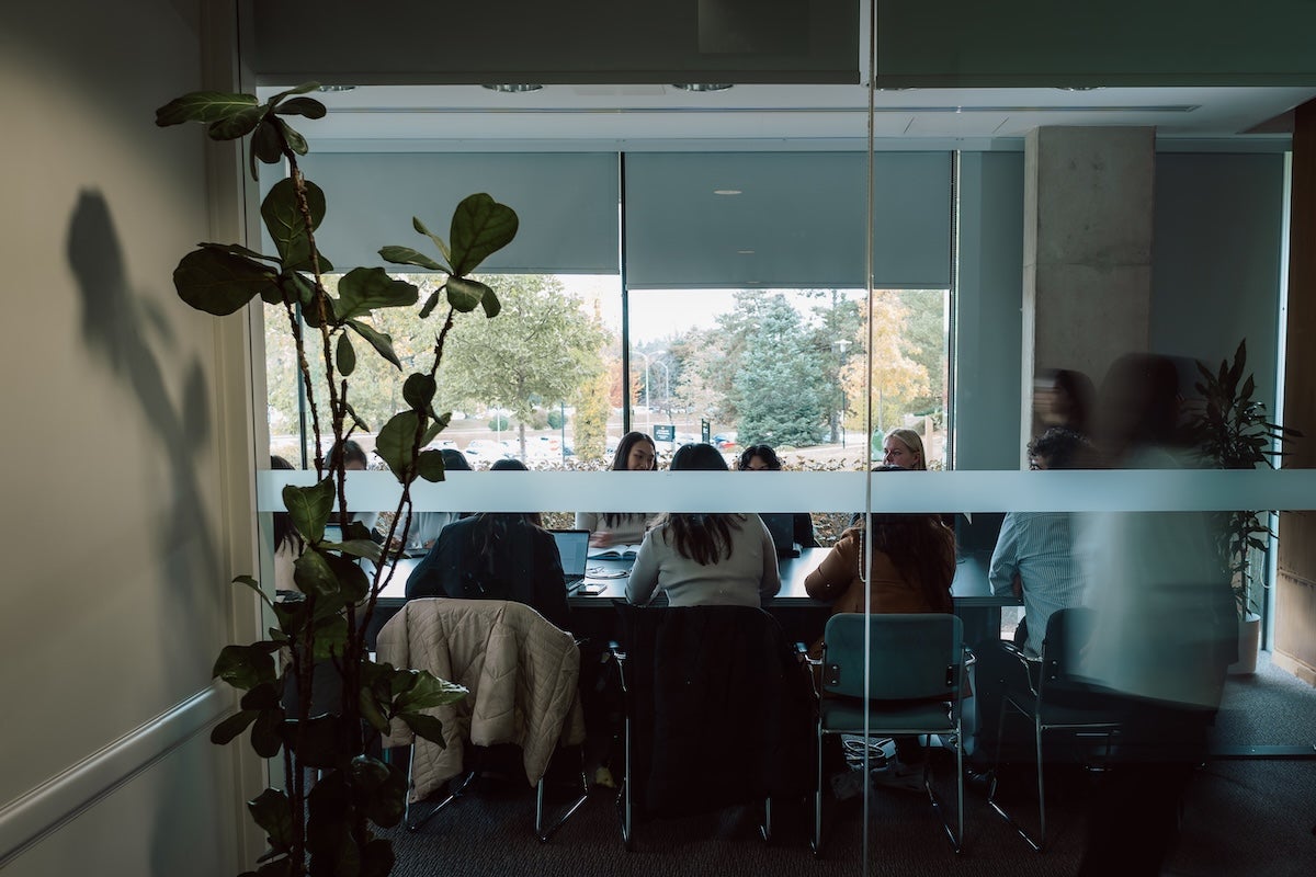 Students seated in a conference room in the Tatham Centre overlooking ring road.