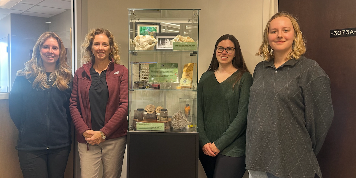Representatives from the EcoLab with the display items.