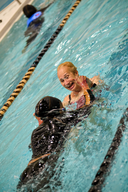 Jacky Beckford-Henriques swims with a student.