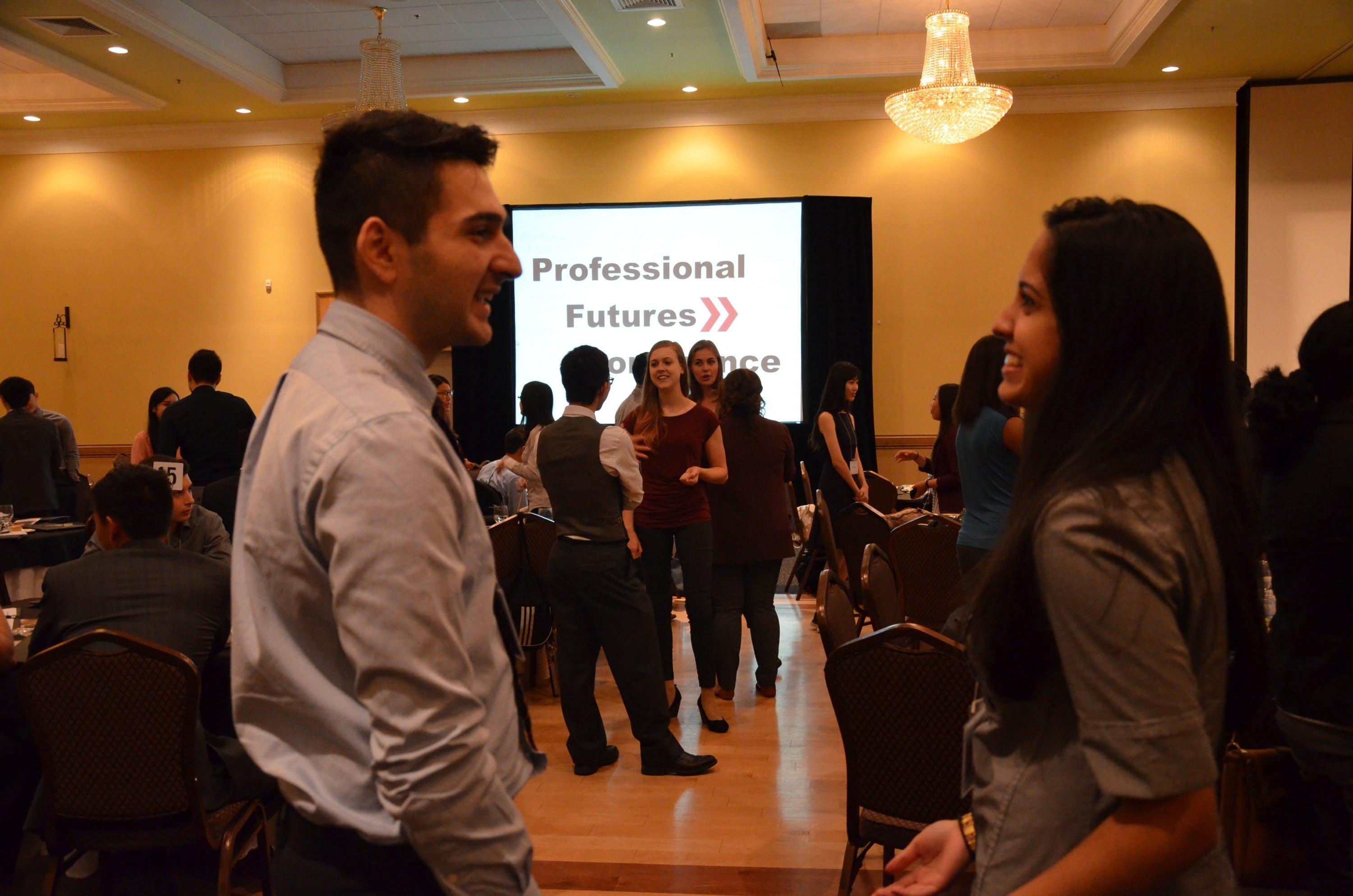 Two students converse at the Professional Futures conference.