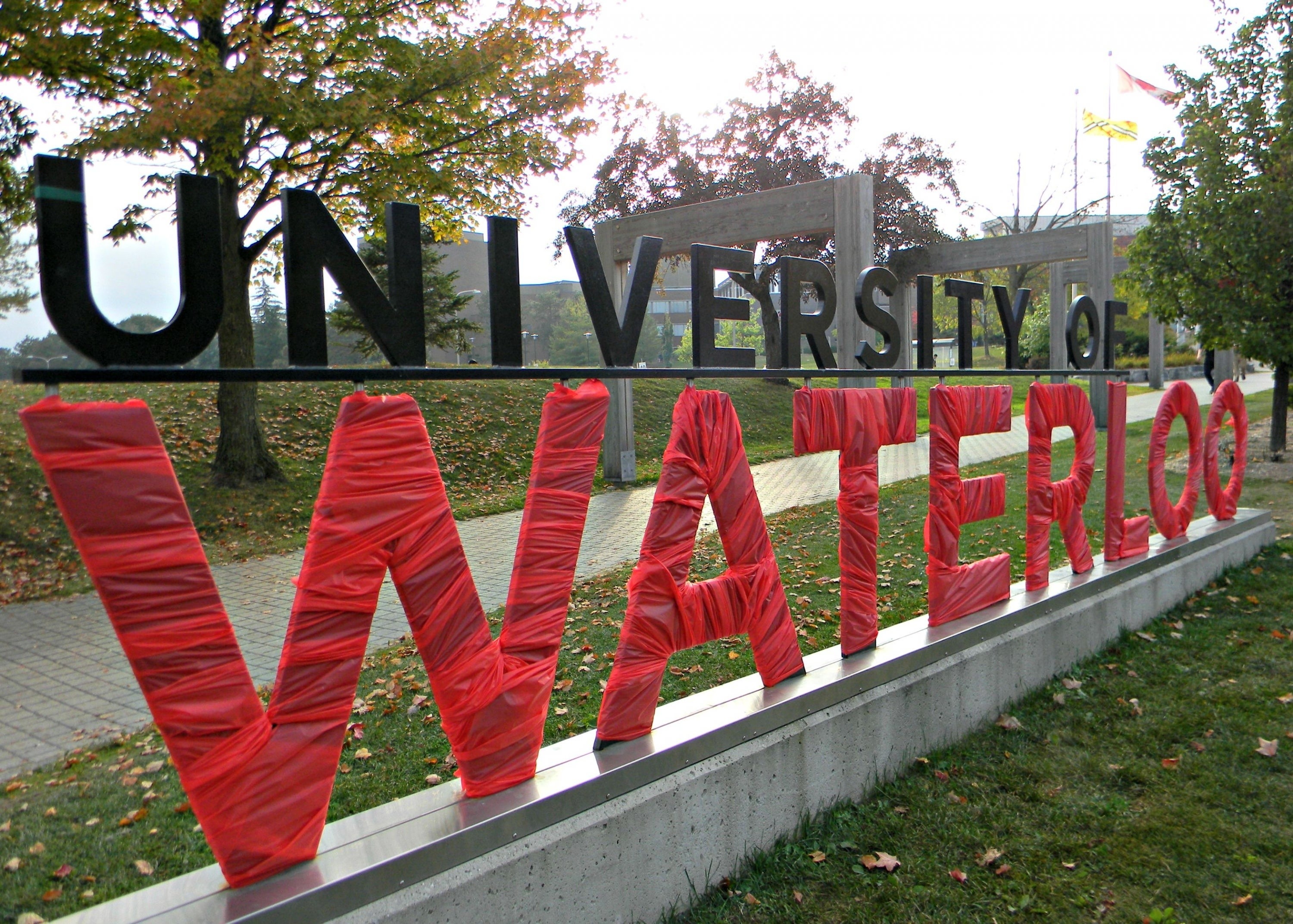 The University of Waterloo south campus sign wrapped in red.