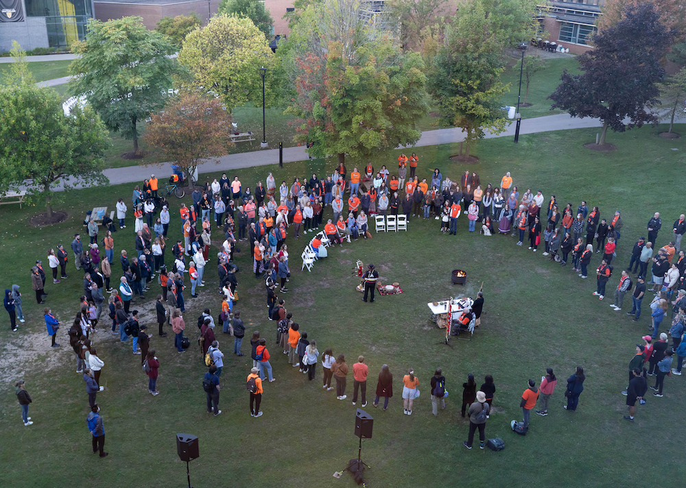 People gather for the sunrise ceremony on the BMH Green.
