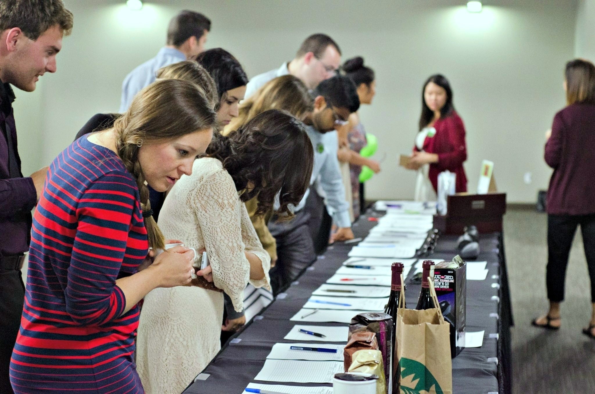 A silent auction at the Dining in the Dark fundraiser.