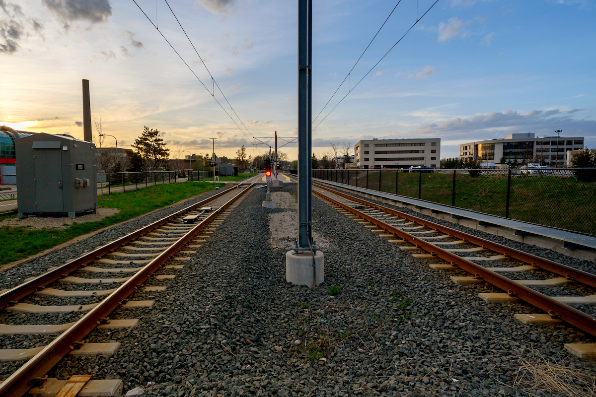 The LRT train tracks on campus at sunset.