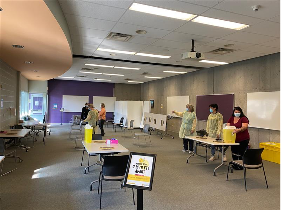 Volunteers staff the pop-up vaccination clinic.