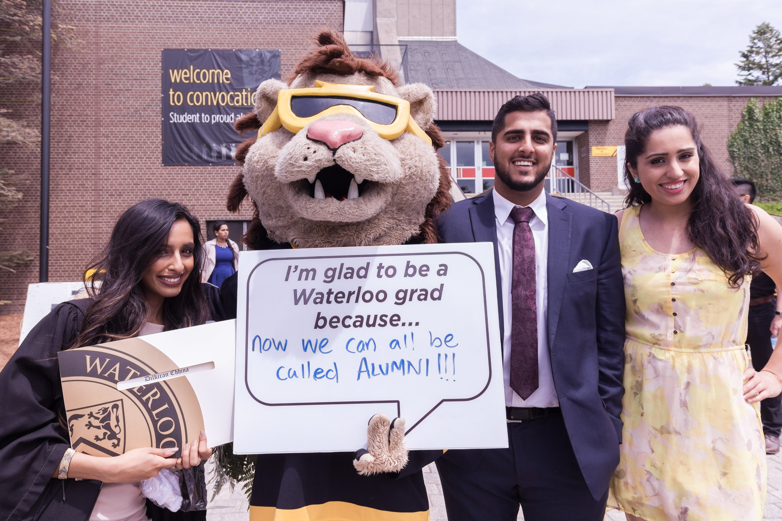 New graduates pose with King Warrior.