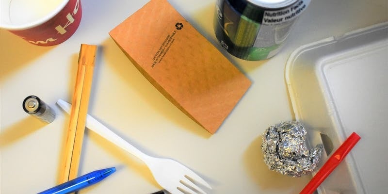 Various waste items arrayed on a table.