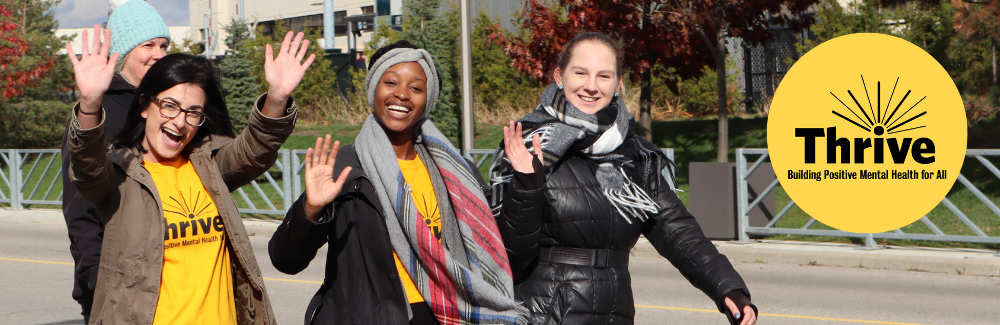 People take part in a Thrive wellness walk.