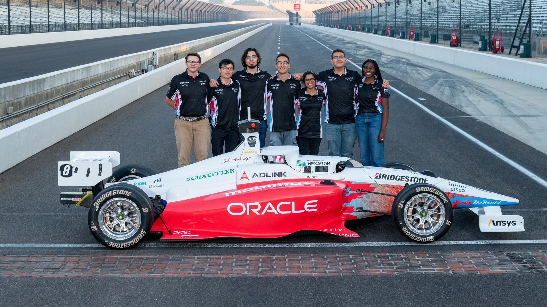 The Waterloo student team with their autonomous racecar.