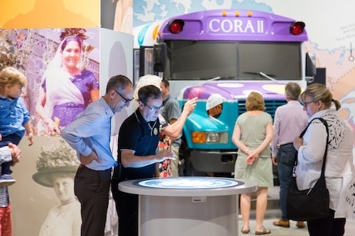 The launch of the Trailblazers exhibition at the Waterloo Region Museum featuring a Purple school bus.
