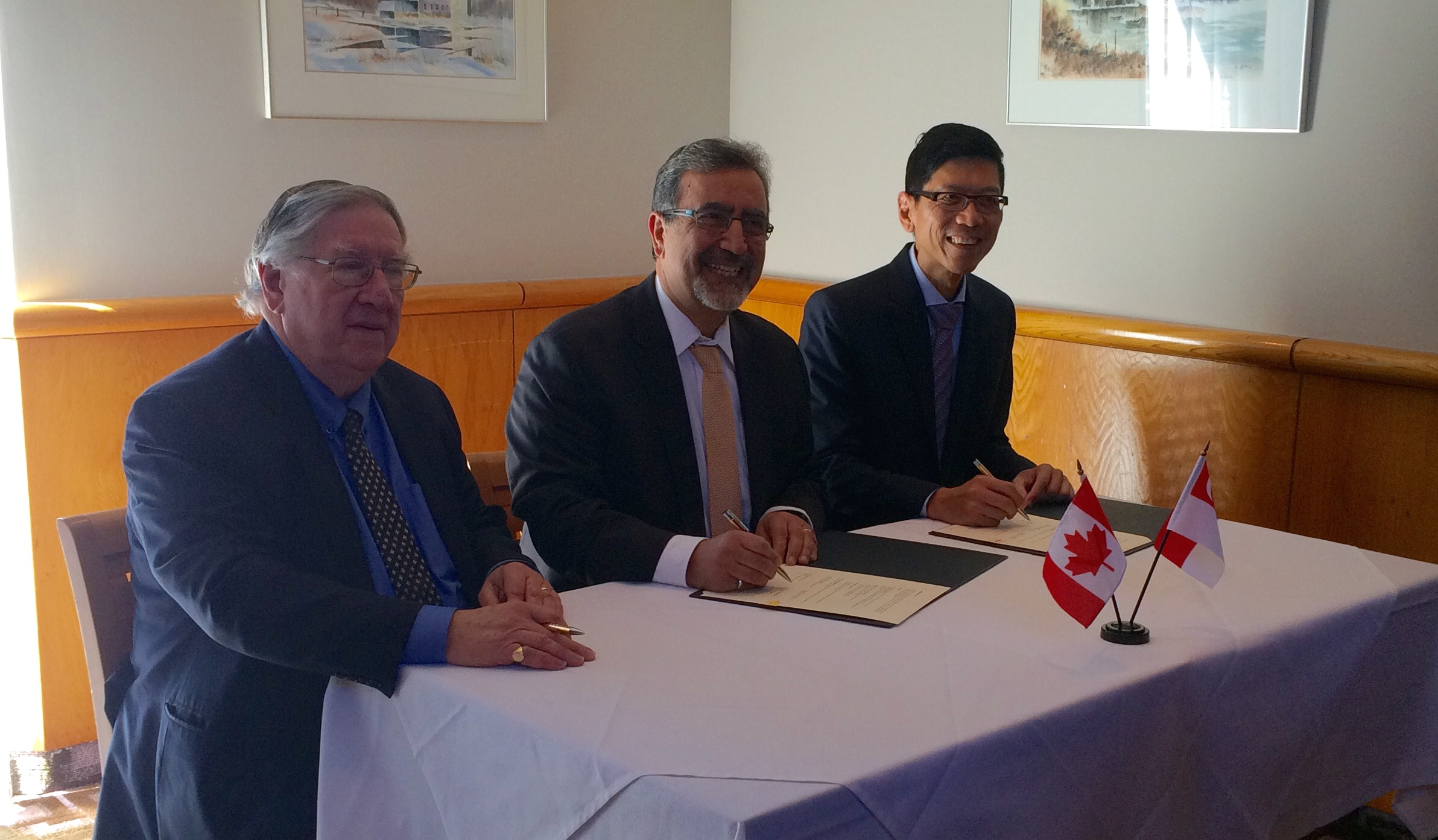 Vice-President, University Research, George Dixon, President Feridun Hamdullahpur, and Professor Tan Chorh Chuan, NUS president, reunite on campus.