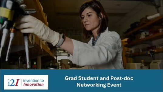 A woman in a lab manipulates equipment.