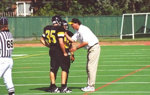 Chris "Greek" Triantafilou coaching two Warriors players in 1999.