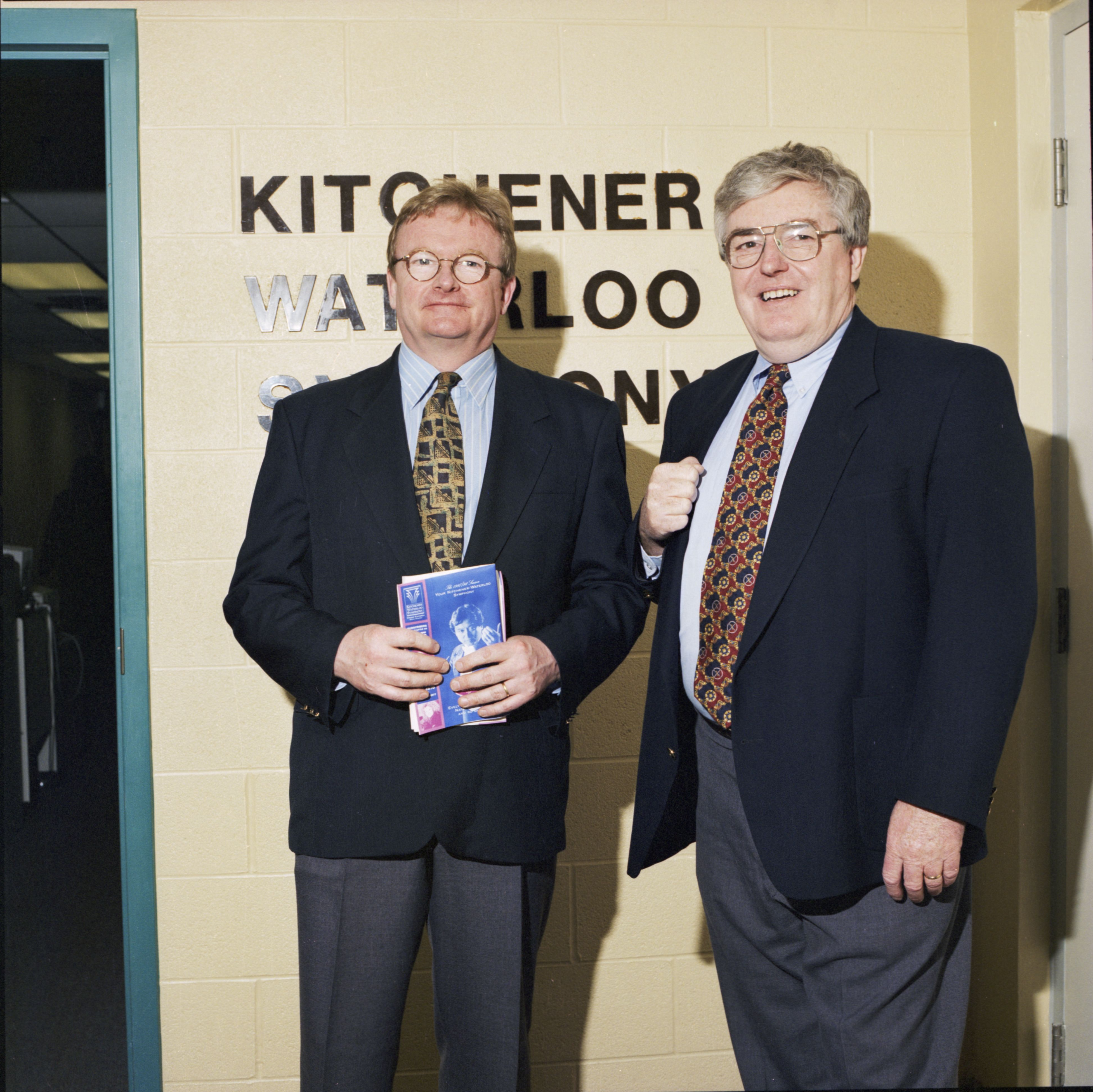 Gary Waller presents a K-W Symphony employee with an award for volunteering in 1997.