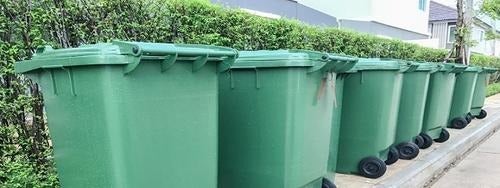 A lineup of green bins.