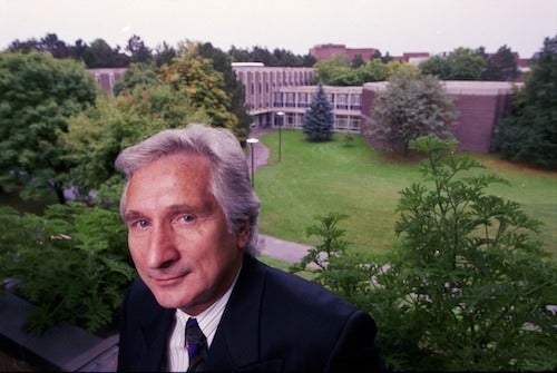 James Downey on the president's office balcony with the Modern Languages in the background.