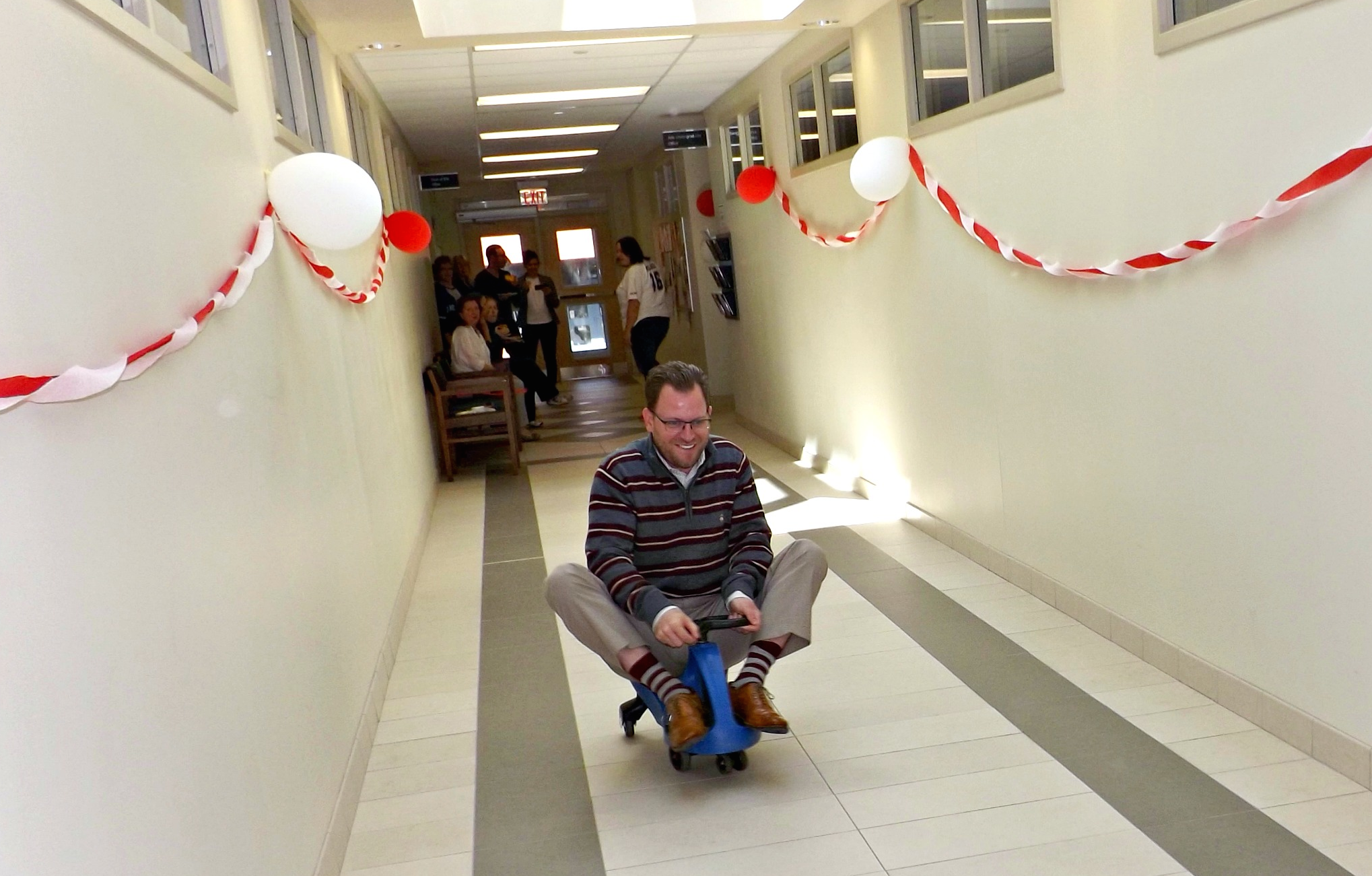 A man rides a plasma car. You know, for charity.