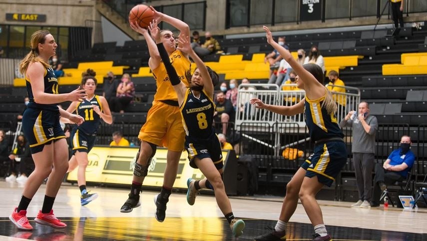 Warriors Basketball team member Kaitlyn Overeem jumps during a game.