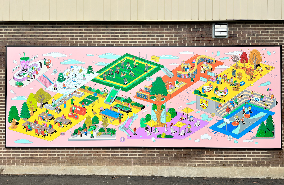 The large mural showing an isometric view of a community.