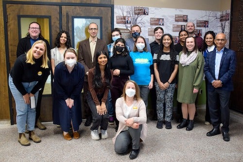 Participants in the GreenHouse social impact showcase pose for a group photo.