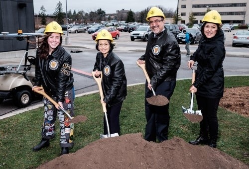 Hannah Gautreau, engineering student and president of EngSoc B, Pearl Sullivan, dean of engineering, University of Waterloo President Feridun Hamdullahpur and Elahe Jabari, PhD candidate in mechanical and mechatronics engineering, put shovels in the ground at E7 groundbreaking event.