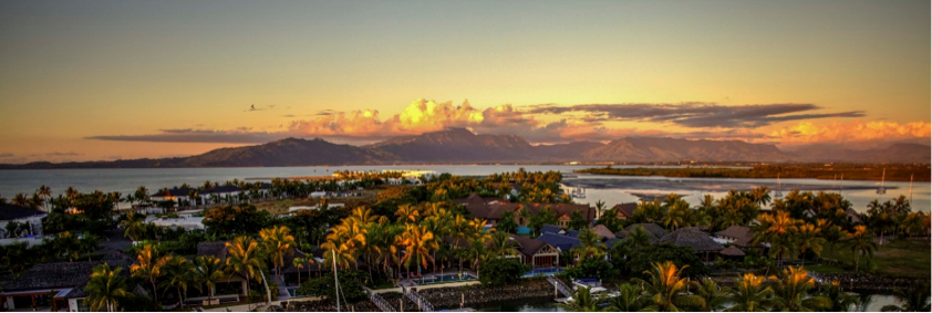 A panorama view of a village at sunset.