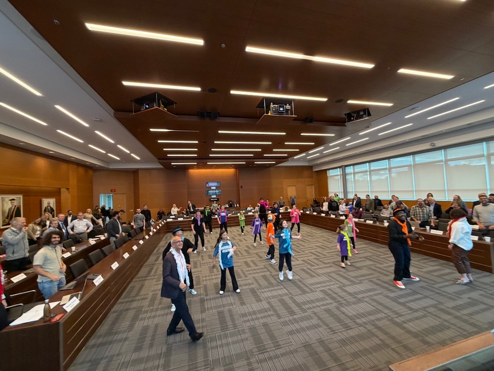 President Goel joins deans and students dancing in the Senate chamber.