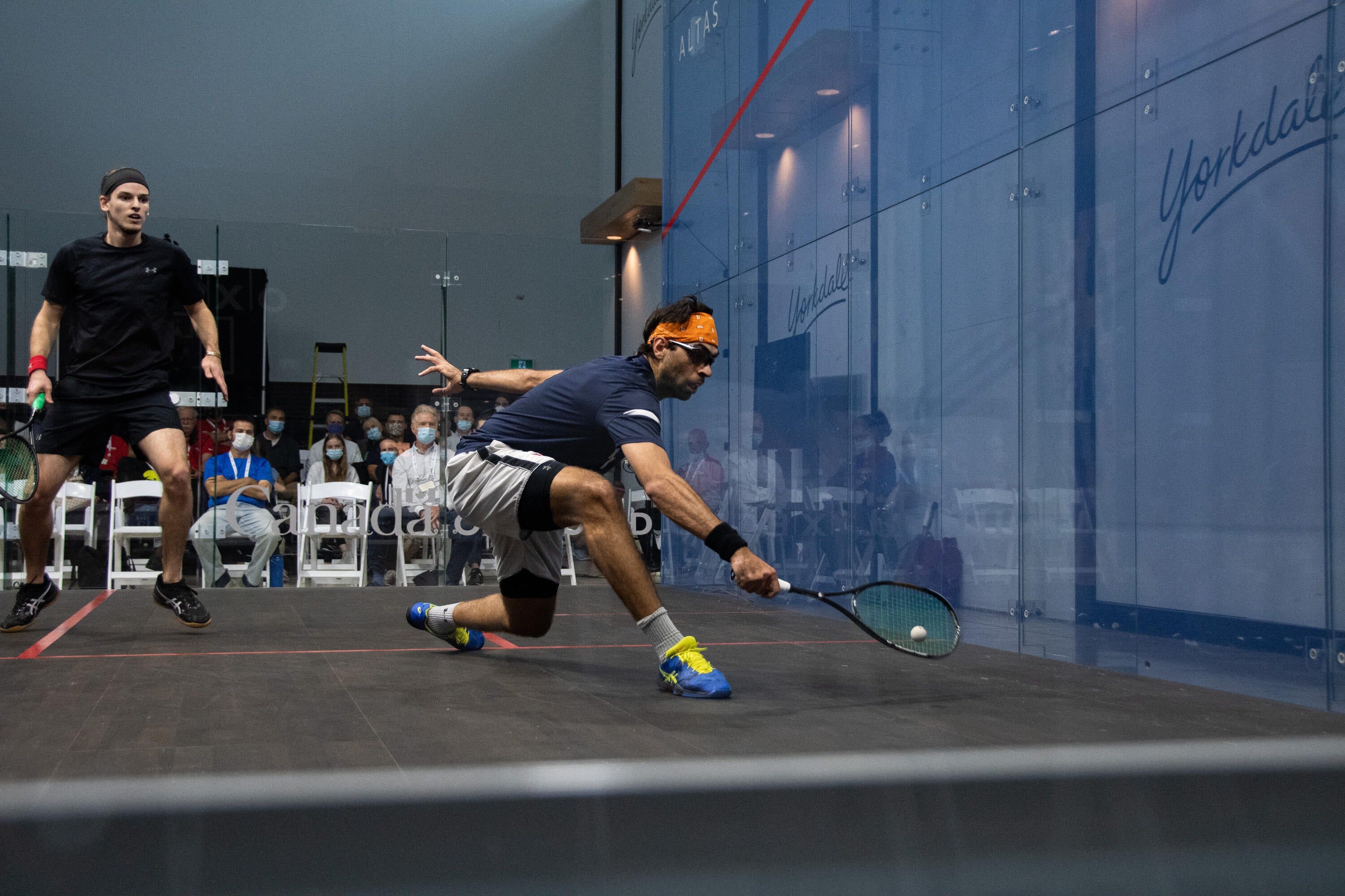 Cameron Seth (front) in action on the glass court at Canadian nationals 2021, hosted in the Yorkdale Mall. Seth made it to the quarter-finals before losing out to the number one seed.