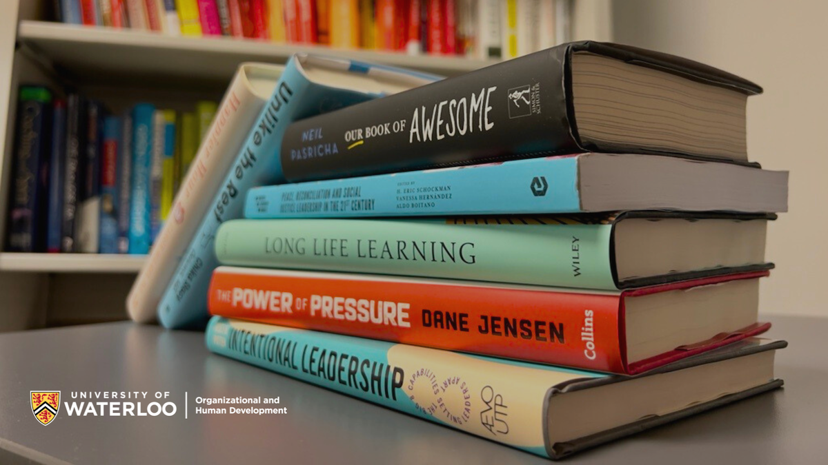 Stack of books on a table in a library.