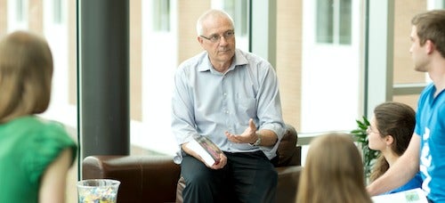 Professor Lowell Ewert speaks to students during a seminar.