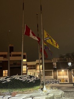 Flags at south campus hall flying at half mast.