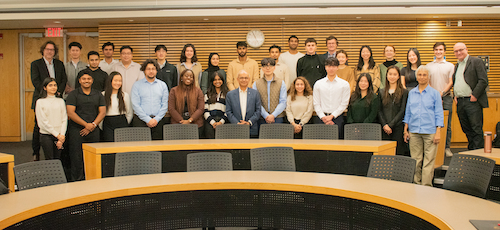 President Vivek Goel with students and faculty.