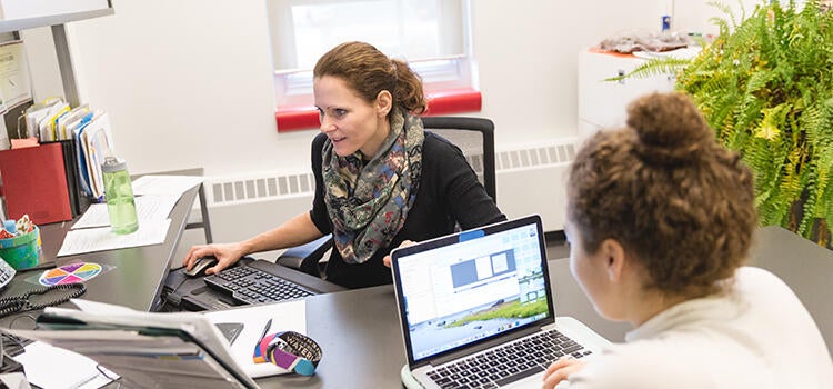 An academic advisor speaking with a student.