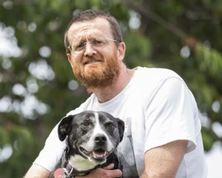 Professor Neil Carr and one of his dogs.