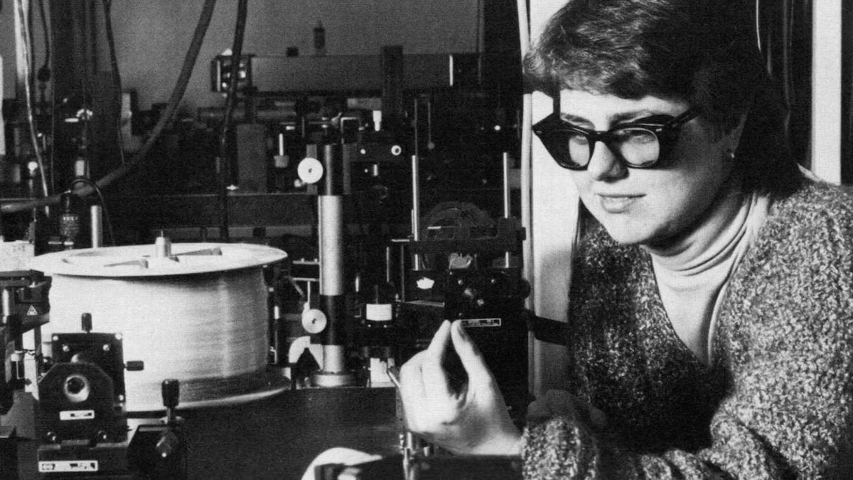 Donna Strickland wears protective glasses in a laser lab.