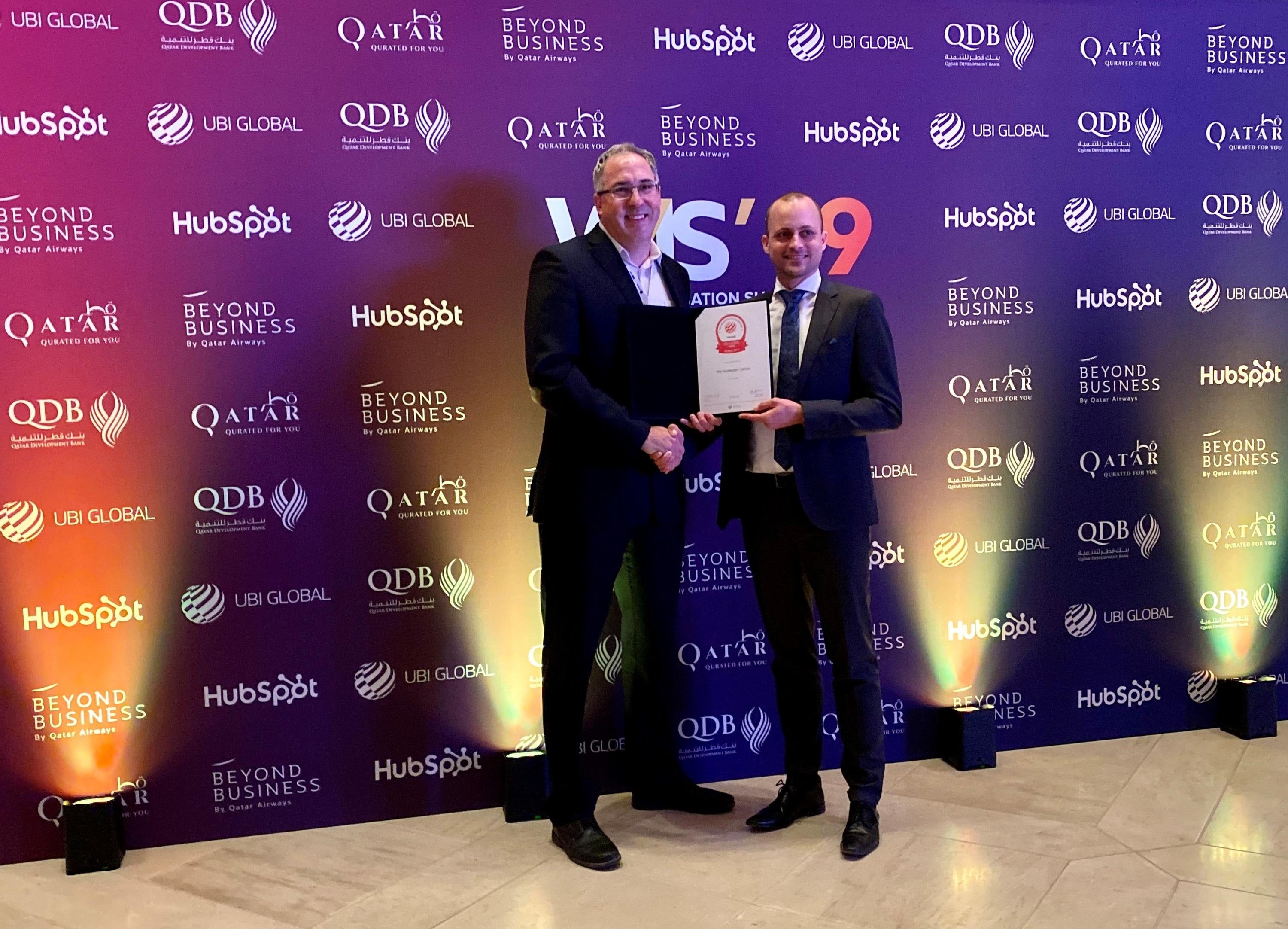 Accelerator Centre CEO Paul Salvini accepting World Top Five award from Holger Meyer