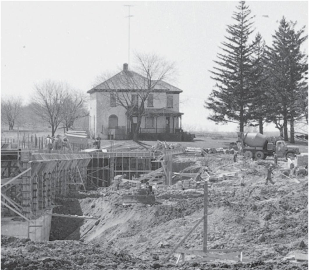 The Graduate House watches over the open construction site that would become the Douglas Wright Engineering building.