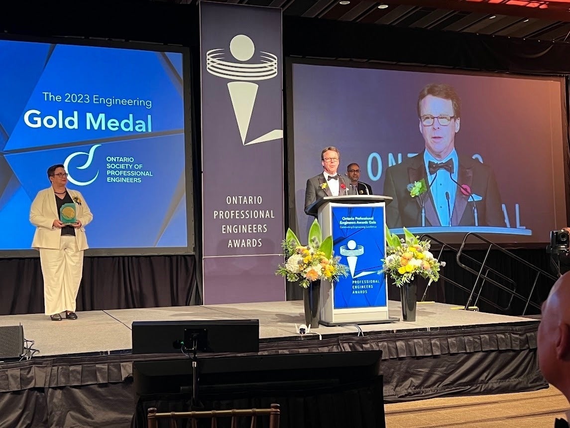 Dr. John McPhee on stage at the award ceremony.