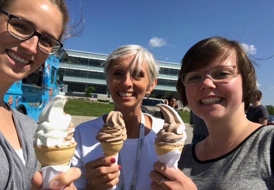 Waterloo employees with free ice cream and wide smiles.