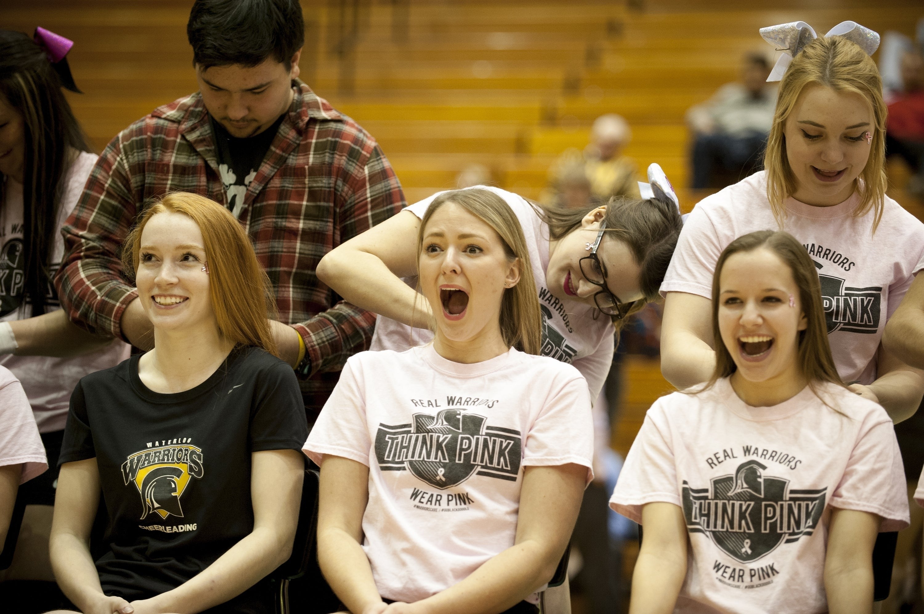 Volunteers get their hair cut for charity.