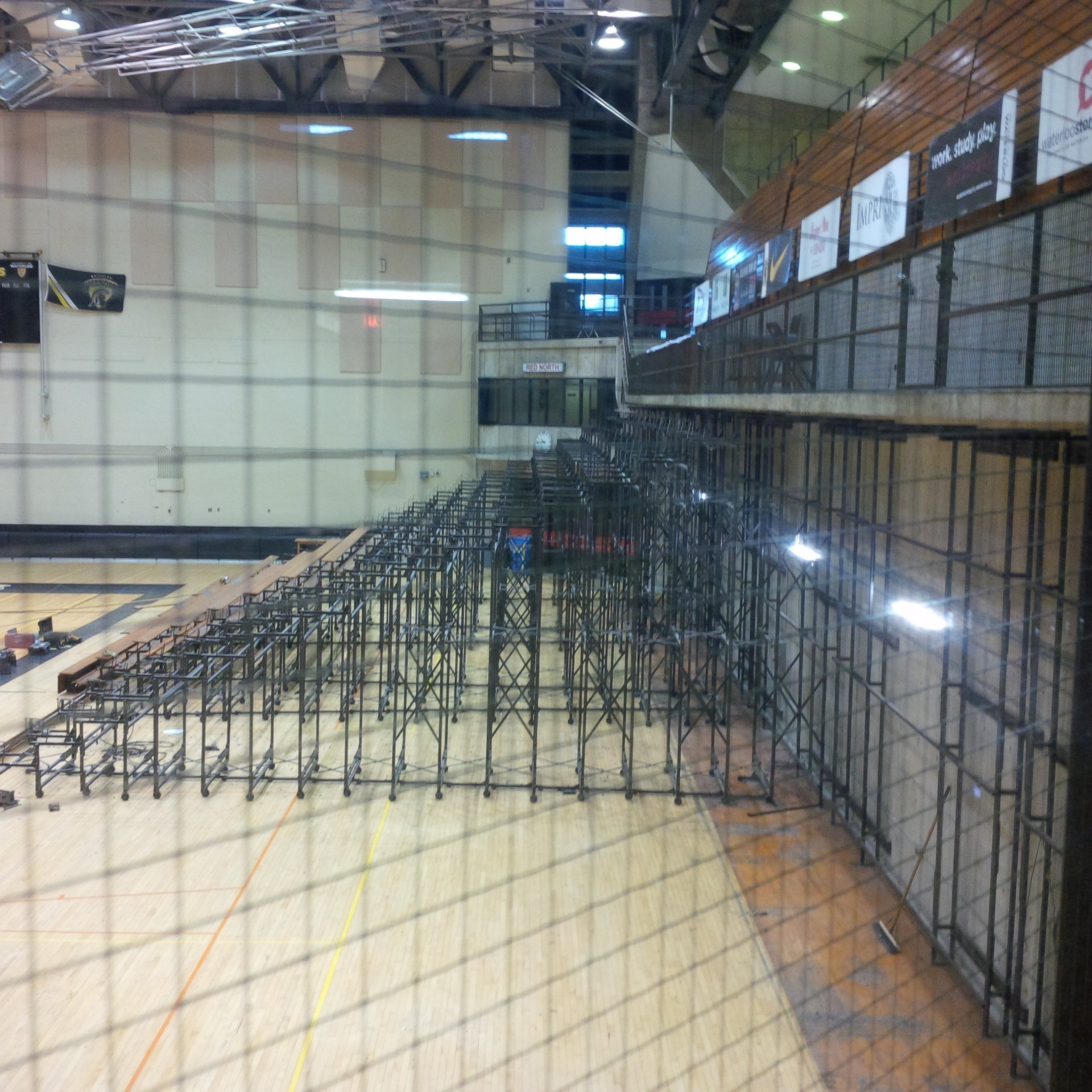 The metal latticework of the bleachers inside the PAC.