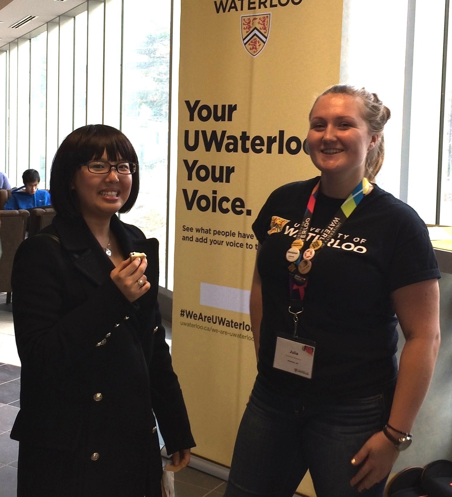 Two volunteers at a UWaterloo kisok.