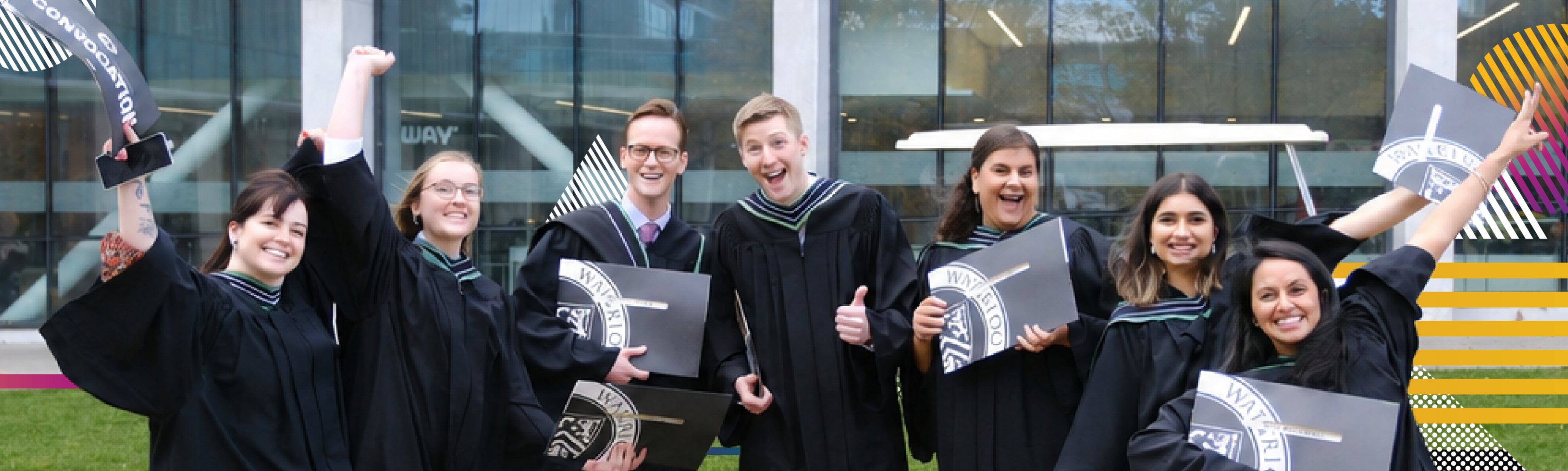 Students in caps and gowns celebrating graduation