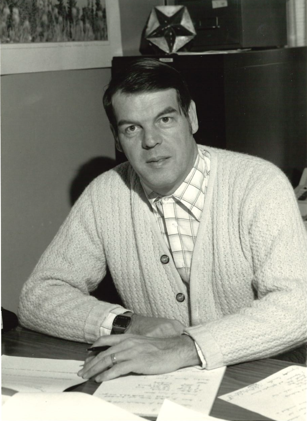 Ron Mullin sits at his desk in 1982.