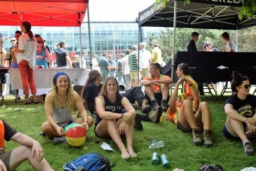 group of staff on a grass lawn with picnic gear